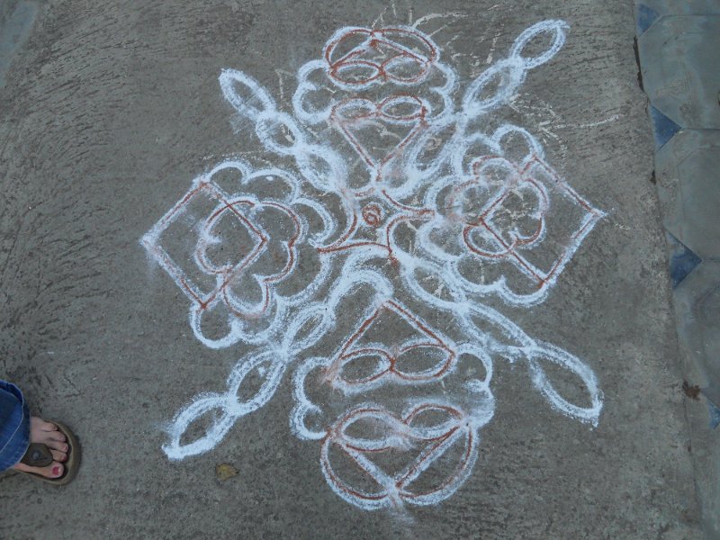 1029594_KolamBangalore.jpg - Mandela in front of Jen and Martin's house for good luck. Drawn in rice powder.
