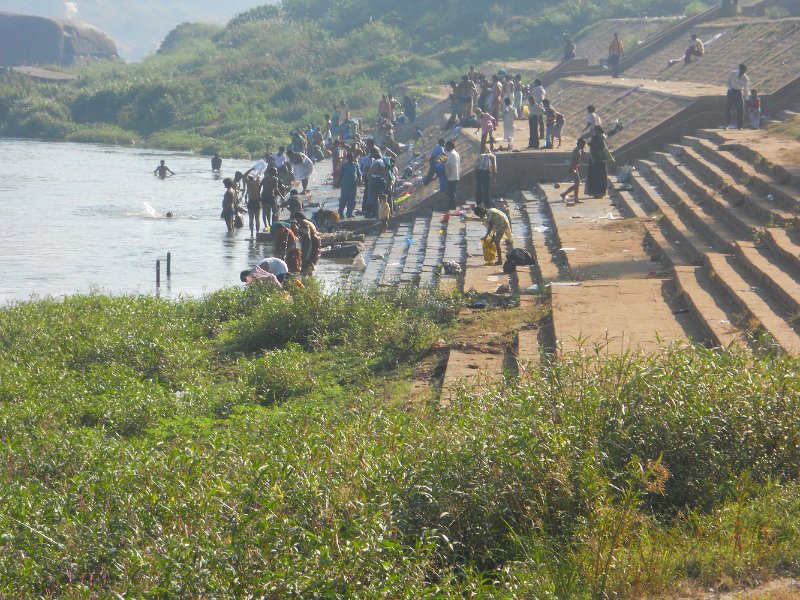 1109643_BathingAtHampi.jpg - Bathers on the temple steps by the river at Hampi.
