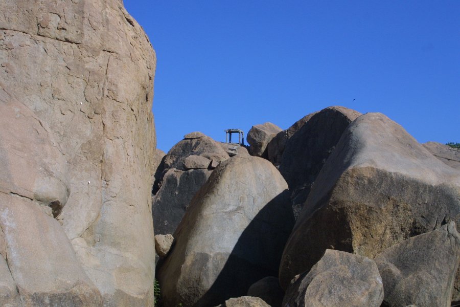 1167000_BouldersAndRuinsOnHillHampi.jpg - Ruins and boulders on the hill at Hampi.