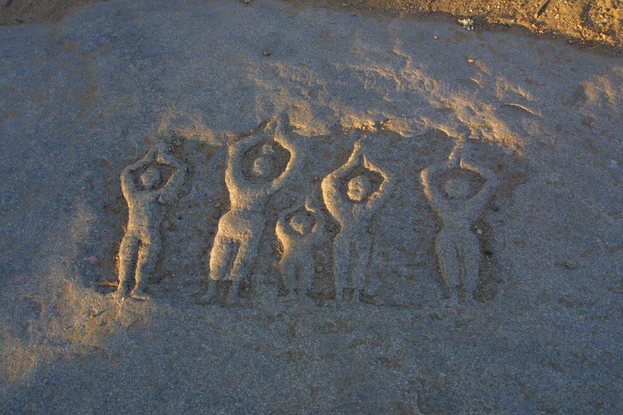 1234000_PeopleProstrateCarvingHampi.jpg - Carving of people prostrate and praying near Vitthala Temple Hampi.