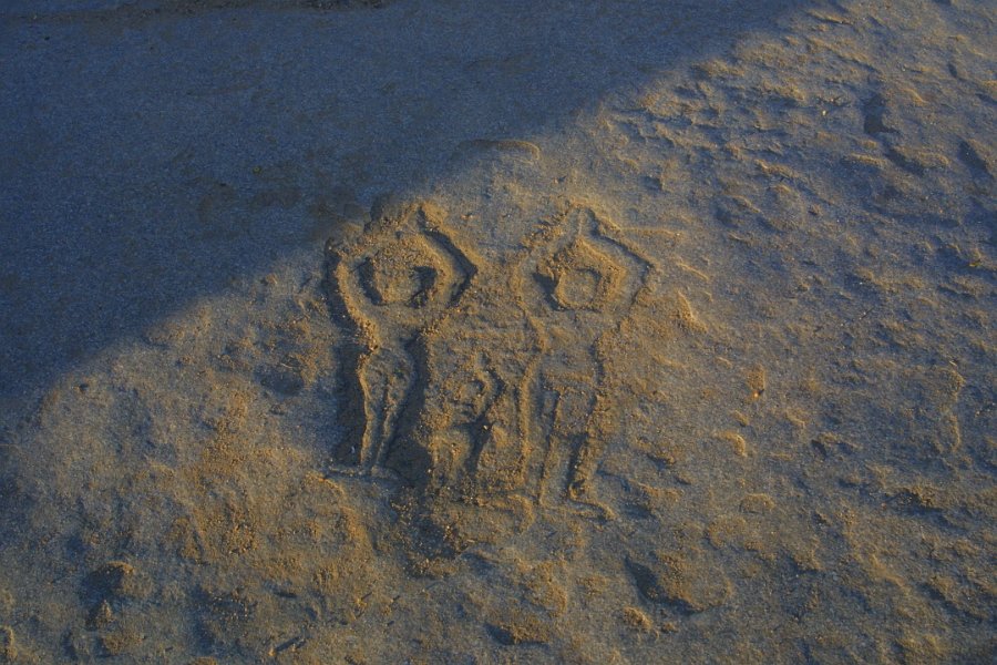 1235000_FamilyProstrateCarvingHampi.jpg - Carving of family prostrate and praying near Vitthala Temple Hampi.