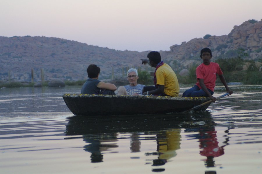 1253000_CockleTourHampi.jpg - Tourists in a coracle on the river.