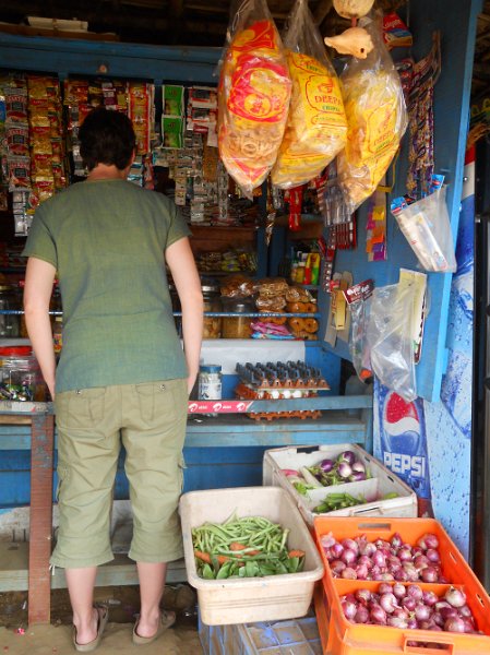 1681873_JenBuyingCellPhoneMinutesTamilNadu.jpg - Jen buying cell phone minutes by the road in Tamil Nadu.