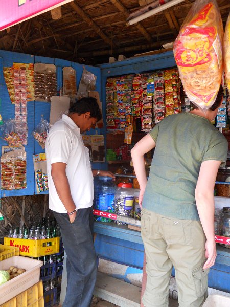 1681874_JenBuyingCellPhoneMinutesTamilNadu.jpg - Jen buying cell phone minutes by the road in Tamil Nadu.