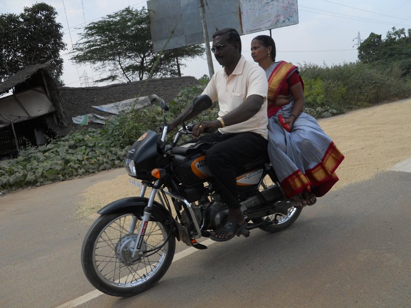 1681890_OnTheRoadTamilNadu.jpg - Riding side saddle on a motorcycle in Tamil Nadu.