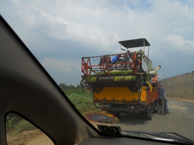1681893_CombineOnTheRoadTamilNadu.jpg - Combine on the back of a truck. Tamil Nadu.
