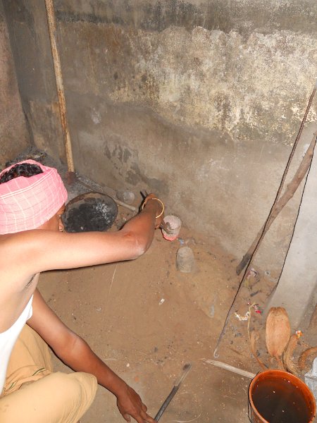 1742907_MetalStatuesByHandThanjavur.jpg - A worker preparing to make a brass statue. Thanjavur.