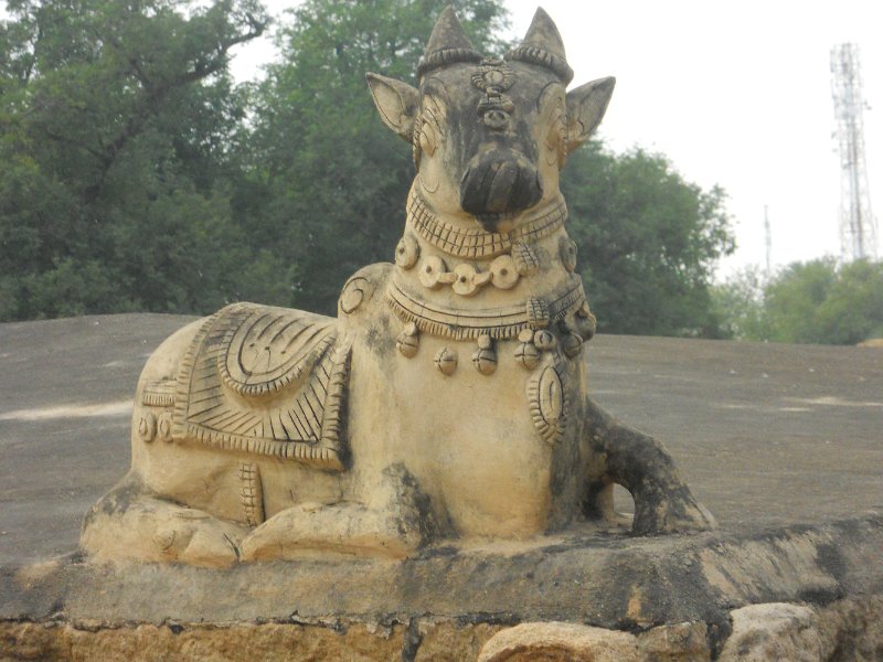 1796932_AiravateswararTemple.jpg - Nandi on the roof of nearby temple outside the weavers house.