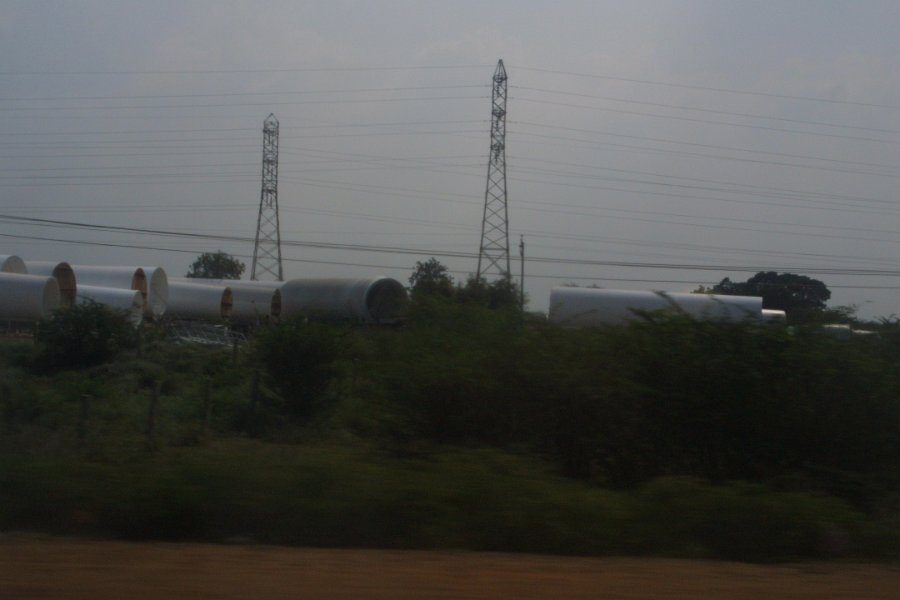 1811000_WindTurbineBases.jpg - Wind turbine towers beside the road to Thiruchi.
