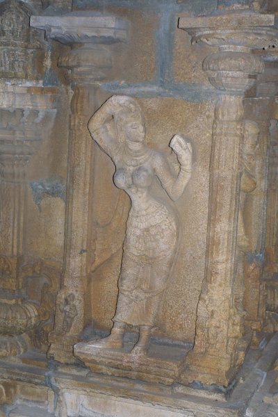 1854000_WomanApplyingMakeup.jpg - Statue of woman applying makeup at the Ranganathaswamy Temple. Thiruchi.