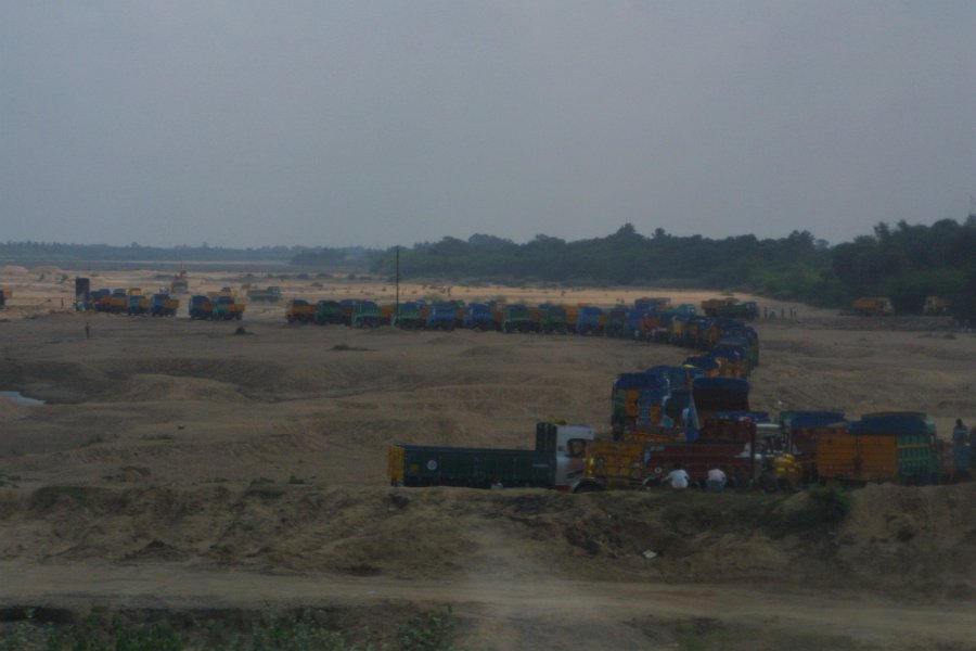 1878000_TrucksLoadingRiverSand.jpg - Trucks loading up on river sand. On the road to Pondicherry.