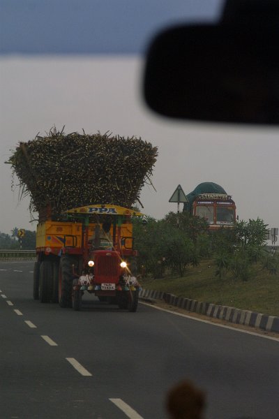 1879000_AnotherBigLoadOfSugarCane.jpg - Tractor with load of sugar cane going the wrong way on the highway