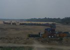 1878000_TrucksLoadingRiverSand